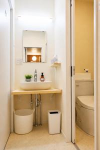 a bathroom with a sink and a toilet at 北鎌倉駅徒歩圏 観光便利 最大7名 2寝室 広々滞在 101 in Kamakura +23 photos