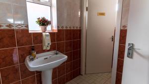 a bathroom with a sink and a window at Greenway Riverside House - Cahersiveen in Foilmore Bridge +16 photos