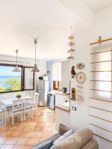 a kitchen and dining room with a table at Agave Scopello in Scopello
