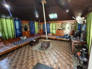 an overhead view of a living room with a couch at Chander Guest House in Kasol