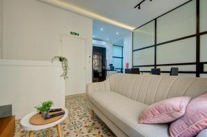 a living room with a couch and a table at The Secret - R5 in Senglea +22 photos