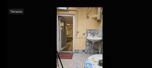 a small bathroom with a sink and a mirror at Casetta sul mare in Savona +73 photos