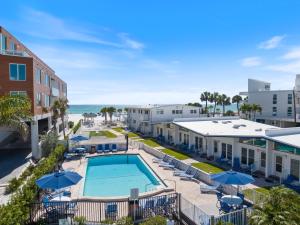 a view of the pool and beach from the balcony of a resort at Sea Crest in Sarasota