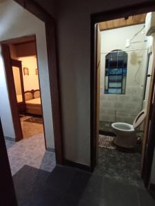 a bathroom with a toilet in a room at Ecoturismo Tripuí in Aiuruoca +25 photos