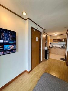 a living room with a hallway and a kitchen at A Comfy Place in Tagaytay in Sampong