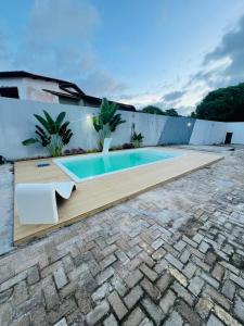 a swimming pool in the backyard of a house at Espaço Familiar com Piscina in São Luís