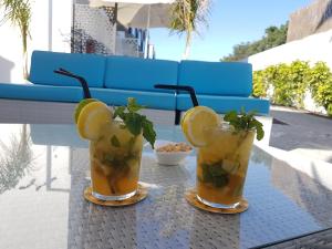 two cocktails sitting on top of a table at FBC Fortuny Resort - Adults Only in Maspalomas