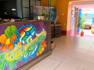 a restaurant with a sign that says krispy kreme at Aguaymanto pisac hostel in Pisac
