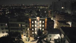 a view of a city at night at Odilia Apartelle in Bangalore