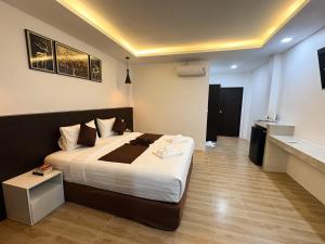 a bedroom with a large bed in a room at Khaosok Unseen Resort in Khao Sok National Park +17 photos