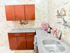 a kitchen with a sink and a counter at Winter House in Luxor +258 photos