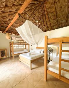Llit o llits en una habitació de Maria Moñitos Hostel