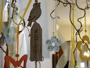 a wooden figurine of a woman hanging on a wall at Pension Waldfriede in Bad Tatzmannsdorf