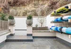 a room with pillows and plants on shelves at 3 Bedroom, 3 bathroom large flat with sea views! in Hastings