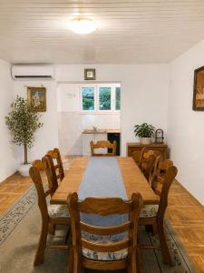 a dining room with a wooden table and chairs at New! Apartment Complex "S" in Čelina