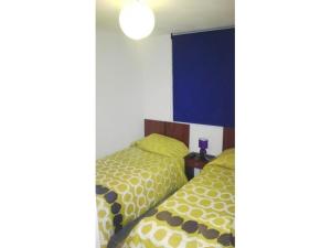 Cama o camas de una habitación en Algarrobo Norte Apartmento