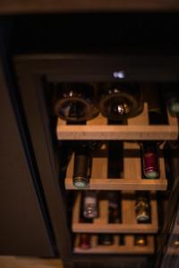 a bunch of wine bottles in a wine cellar at Suite romantique avec jaccuzzi - proche des lacs - La secrète room in La Mure
