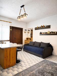 a living room with a couch and a table at Villa Pilgrimos in Ierissos