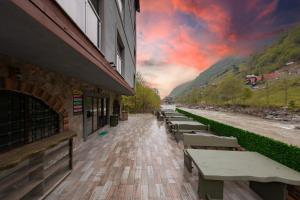 a row of benches sitting outside of a building at Elikti Otel in Ardeşen +27 photos