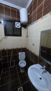 a bathroom with a toilet and a sink at مساكن جدة in Jeddah