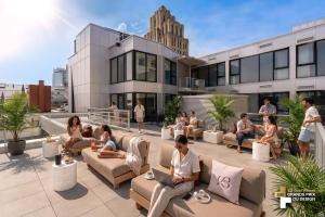 a group of people sitting on the roof of a building at Bresoles Hotel in Montreal