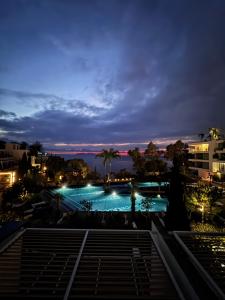 a view of a swimming pool at night at Marina Bay Apartament 1 in Vlorë