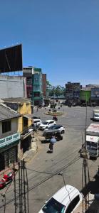 a parking lot with cars parked in a city at Aliya Stay in Galle