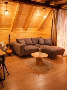 a living room with a couch and a table at My Dream - Blidinje in Blidinje