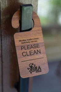 a wooden door with a piece of sign on it at Gila House - Adults only in Gili Islands