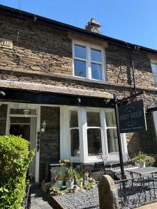a building with a sign in front of it at The Dozy Deer in Windermere +23 photos