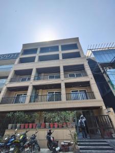 a building with motorcycles parked in front of it at Hotel Radha residency inn in Chhatikara
