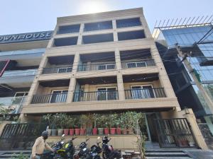 a building with motorcycles parked in front of it at Hotel Radha residency inn in Chhatikara