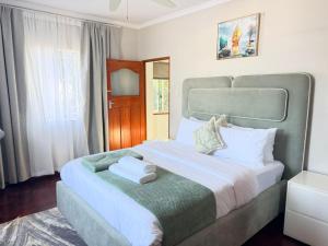 a bedroom with a large bed in a room at Rugira Guest House in Vosburg +183 photos