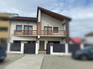 a model of a house with a fence at Stadium Side Rooms in Craiova