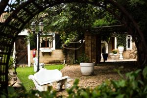 a view of a yard with a white chair and a table at Mercy Tree Manor in eMalahleni