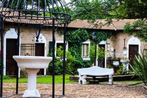 a fountain in front of a house at Mercy Tree Manor in eMalahleni