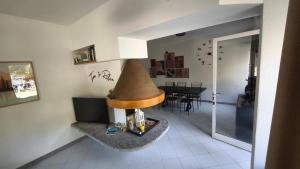 a living room with a fireplace and a dining room at Al Piccolo Pontile Como lake in Mandello del Lario +13 photos