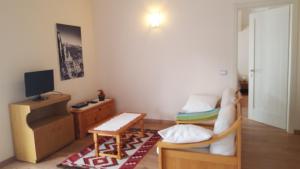 a living room with a couch and a table at Villa Ducati in Vattaro