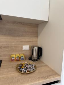 a plate of food on a shelf in a room at NMS Promet in Mrkonjić Grad