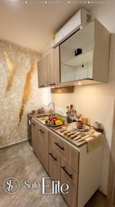 a kitchen with a sink and a counter with food on it at Suites Privadas - Elite Valledupar, Cerca CC Guatapurí y Rio Guatapurí in Valledupar