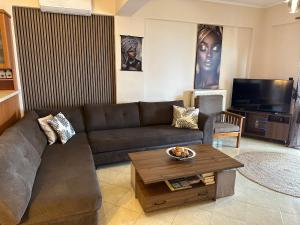 a living room with a couch and a coffee table at Seaview Villa Liandroy in Sellía