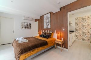 a bedroom with a large bed in a room at LOVE ROOM - Amour Chic et Intime in Montbrison