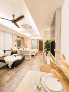 a living room with a couch and a table at Green View Condo in Kathu