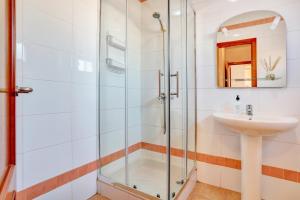 a bathroom with a shower and a sink at Villa Malva in Corralejo +33 photos