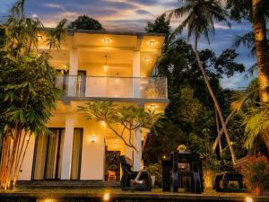 a house with a forklift parked in front of it at Villa 9 March in Unawatuna