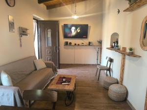 a living room with a couch and a table at Helidoni in Margarítai