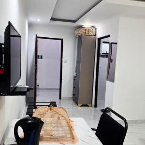 a room with three doors and a table and chairs at Rest & Digest in Serowe