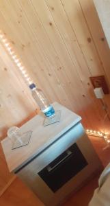 a lamp on top of a table in a room at Welcoming home on the corner in Slănic +8 photos