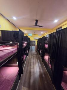 a row of bunk beds in a room at Shri Ashray in Varanasi