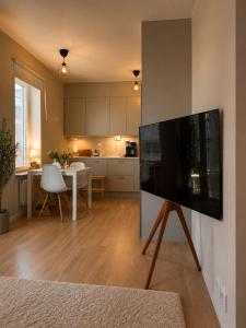 a living room with a large flat screen tv at Modern lägenhet i Vasastan in Stockholm